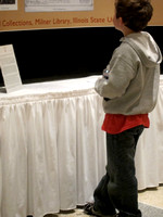 A young visitor studies a display about Lincoln, Davis and Fell created by Illinois State University’s Milner Library staff for the dedication event October 23, 2010.